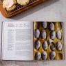 Picture of 108 Asian Cookies open to the recipe for Butterfly Pea Flower Madeleines