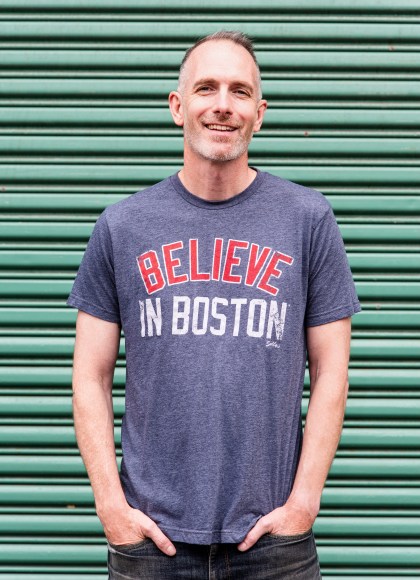 Photo of Chris Wrenn wearing a shirt that says Believe in Boston